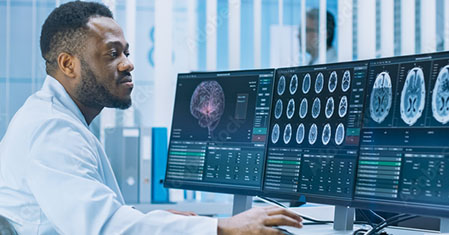 Medical Scientist Working with CT Brain Scan Images on a Personal Computer in Laboratory. Neurologists in Neurolog