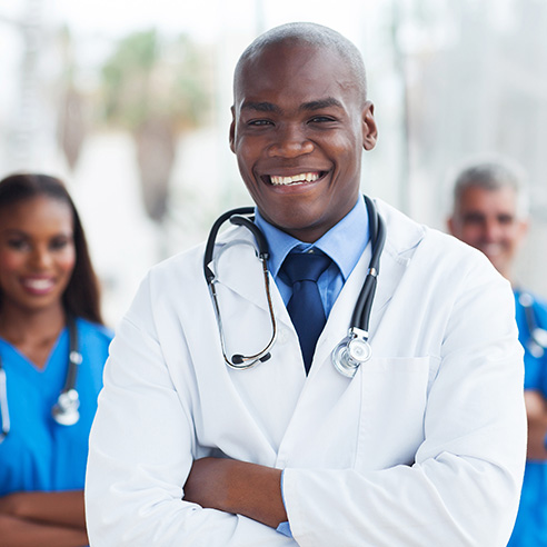 Doctor smiling in white medical coat